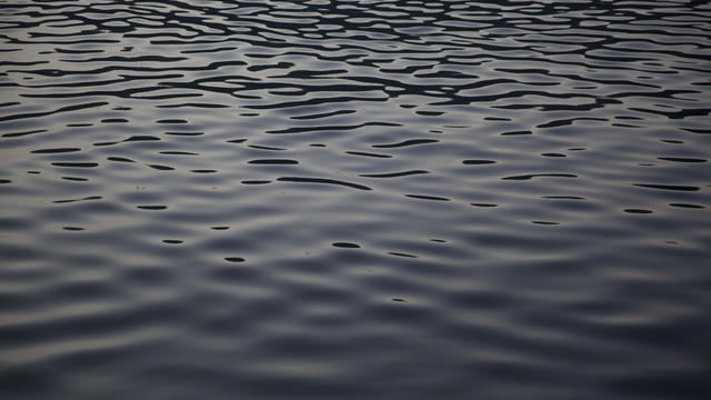 Reflection in london canal at dusk looking like oil 