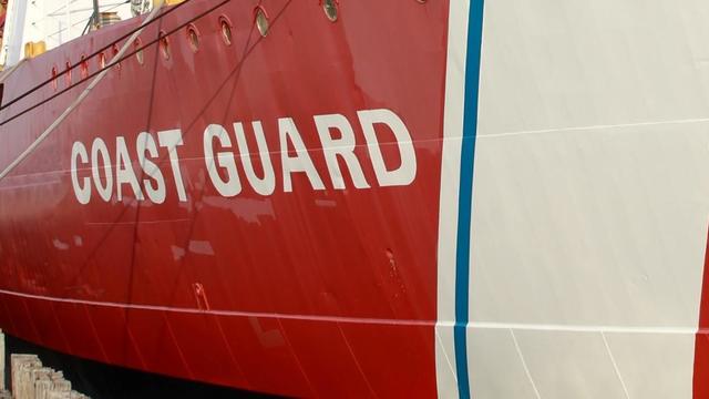 Large coast guard ship at port 