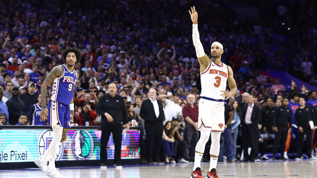 Kelly Oubre Jr. #9 of the Philadelphia 76ers and Josh Hart #3 of the New York Knicks react after Hart's three point basket during the fourth quarter of game six of the Eastern Conference First Round Playoffs at the Wells Fargo Center on May 02, 2024 in Philadelphia, Pennsylvania. 