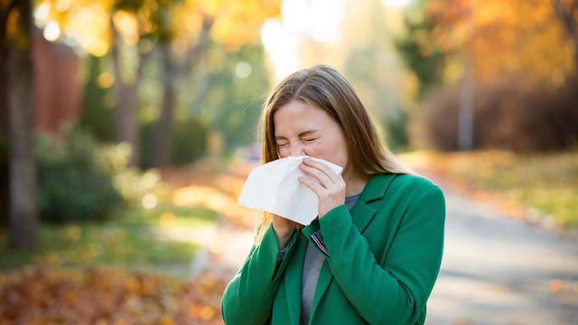 Sick young woman with cold and flu 