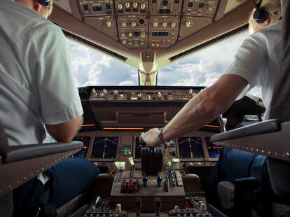 plane cockpit and two pilots