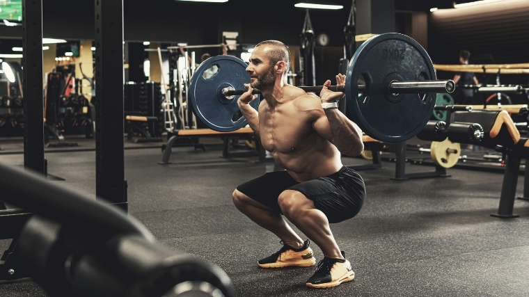 Man squatting weight