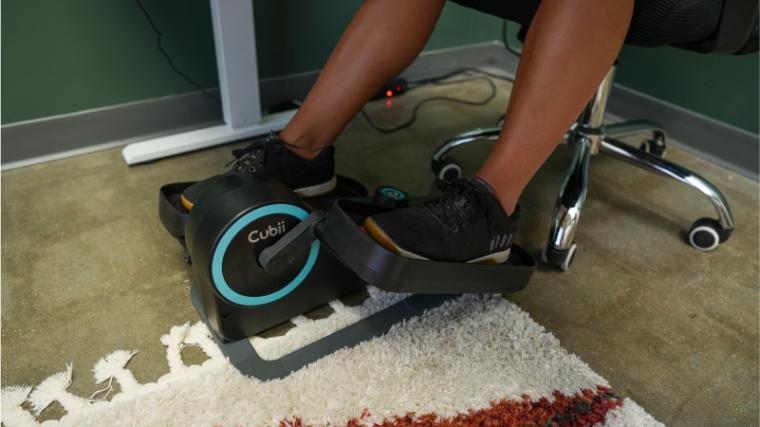 Our tester using the Cubii Move under their desk.