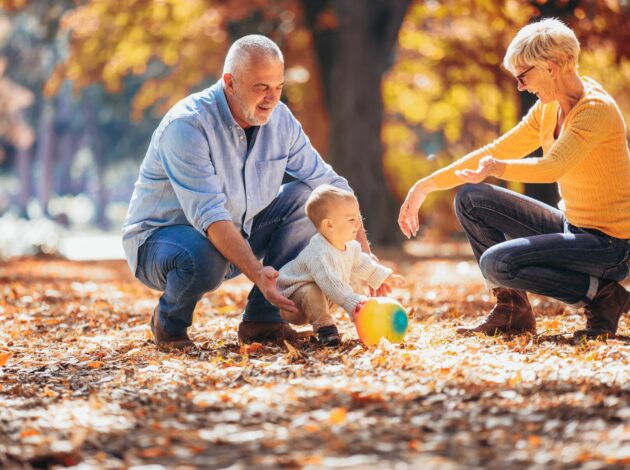 Image of grandparents playing with a baby