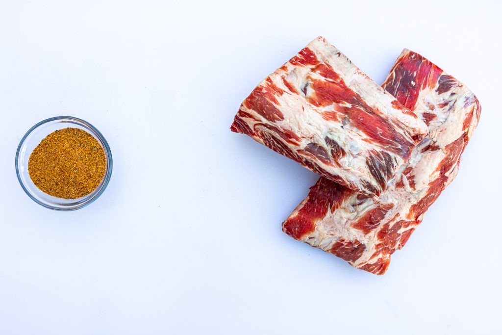 Raw beef ribs and bbq rub