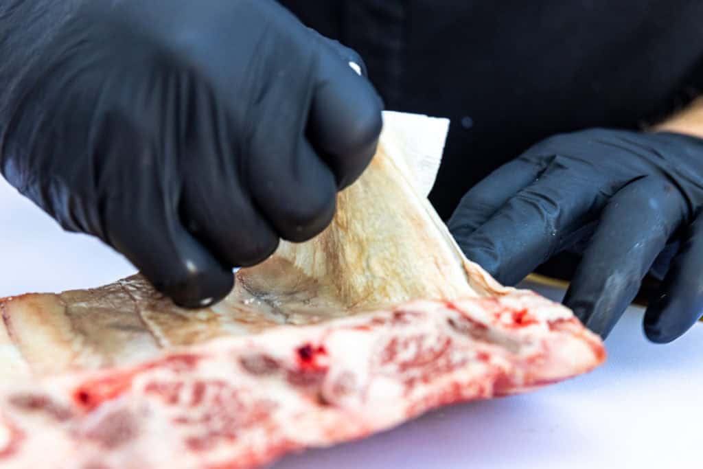 PUlling the membrane from the beef ribs