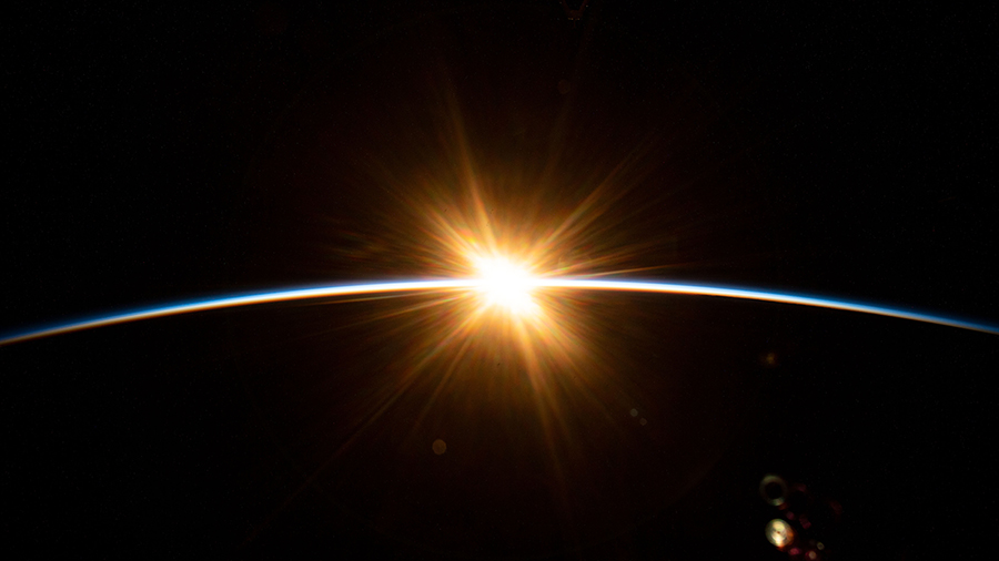The sun's first rays burst over the Earth's horizon during an orbital sunrise as the International Space Station orbited above the Indian Ocean southwest of Australia.