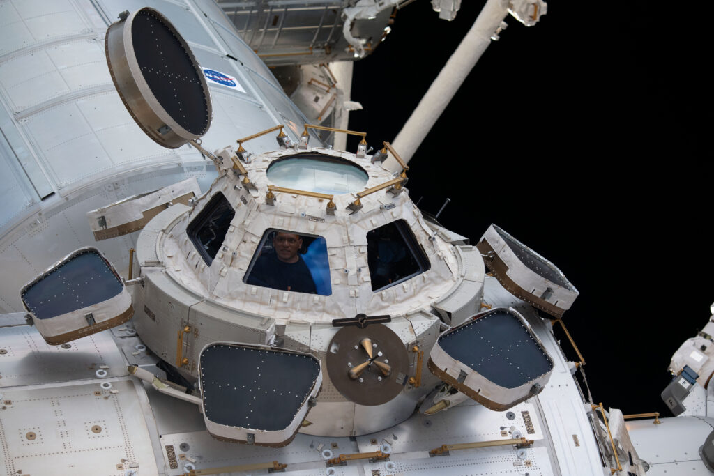 iss068e036064 (Jan. 2, 2023) --- NASA astronaut and Flight Engineer Frank Rubio peers through one of the seven windows in the cupola, the International Space Station's "window to the world."