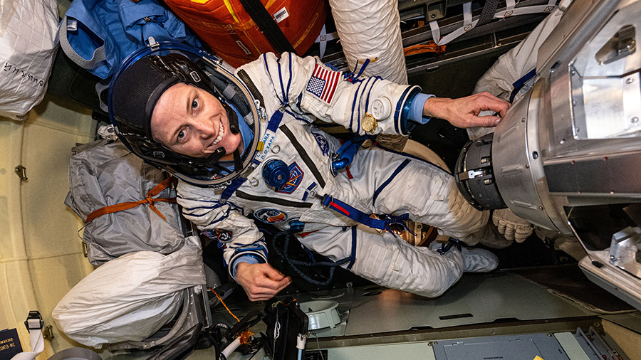 Astronaut Loral O'Hara conducts leak checks and tries on the Sokol launch and entry suit she will wear when she returns to Earth aboard the Soyuz MS-24 crew ship.