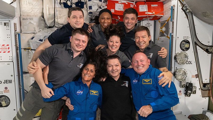 The seven Expedition 71 crew members gather with the two Crew Flight Test members for a team portrait aboard the space station. In the front from left are, Suni Williams, Oleg Kononenko, and Butch Wilmore. Second row from left are, Alexander Grebenkin, Tracy C. Dyson, and Mike Barratt. In the back are, Nikolai Chub, Jeanette Epps, and Matthew Dominick.