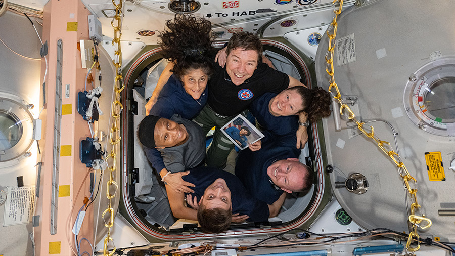 Clockwise from bottom, NASA astronauts Matthew Dominick, Jeanette Epps, Suni Williams, Mike Barratt, Tracy C. Dyson, and Butch Wilmore, pose for a team portrait inside the Unity module.
