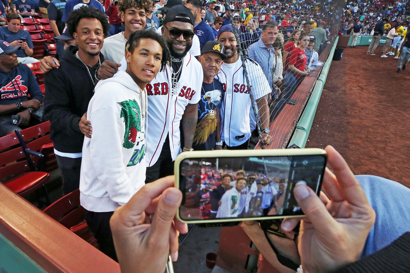 David Ortiz and D'Angelo Ortiz (front left) have spent many years at Fenway Park together.