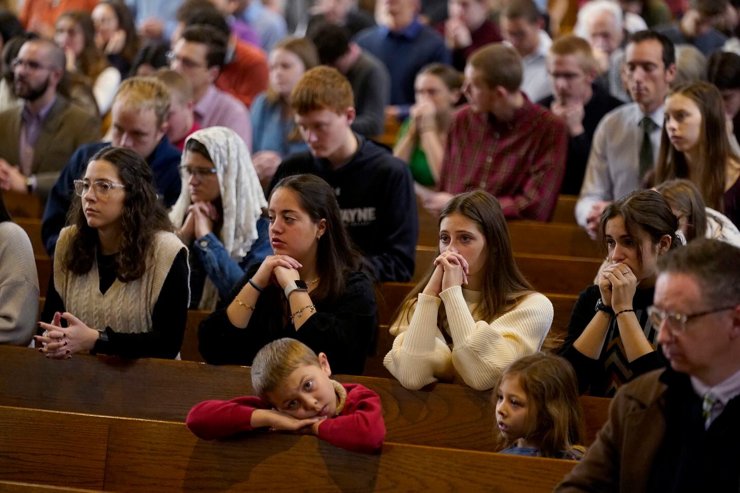 Catholics pray during Mass at Benedictine College in Atchison, Kan. The majority of the college's students are Catholic.