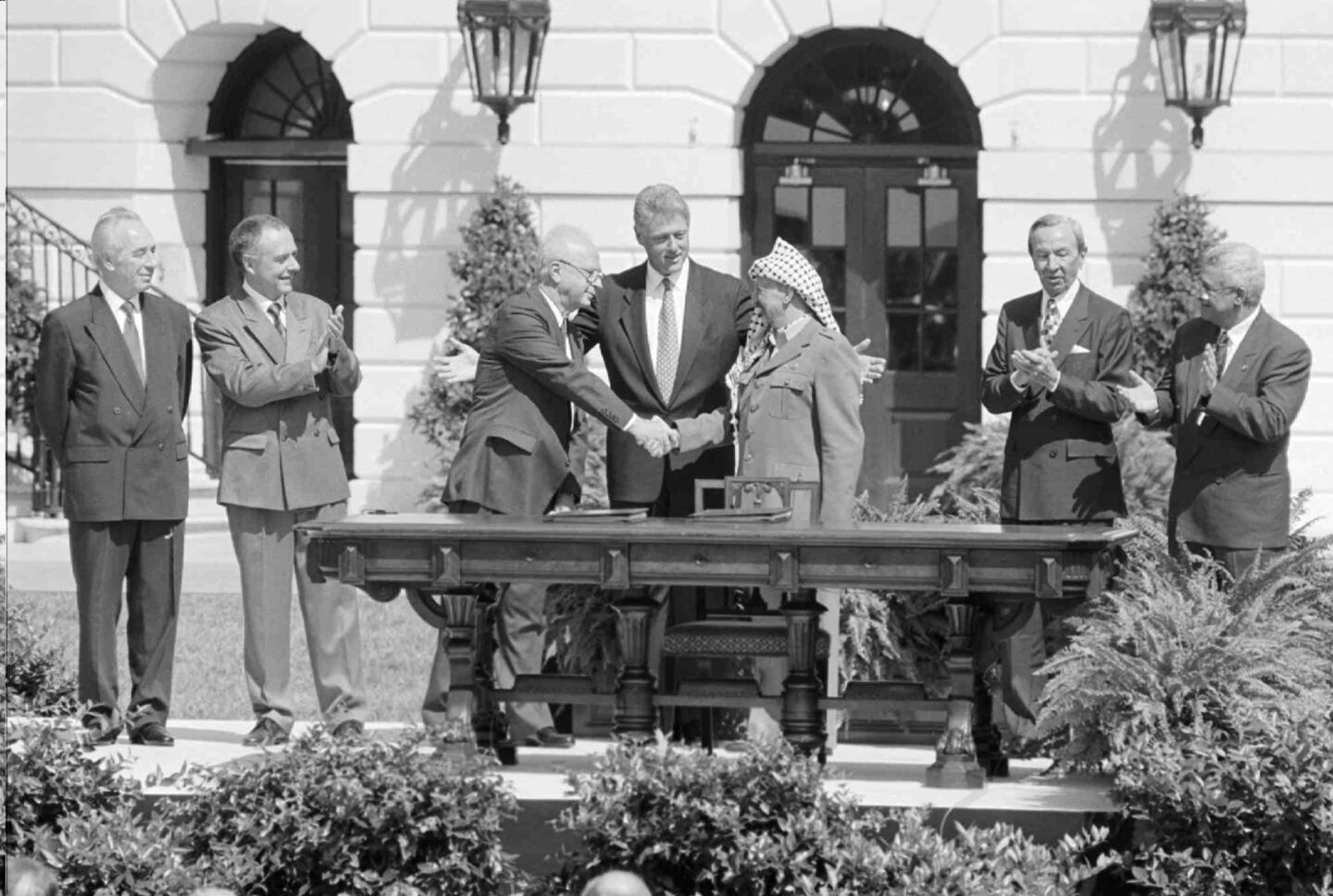 The famous 1993 handshake between Yitzhak Rabin and Yasser Arafat after signing the Oslo accords, the framework for peace that came close to resolving the conflict between Israel and the Palestinians. 