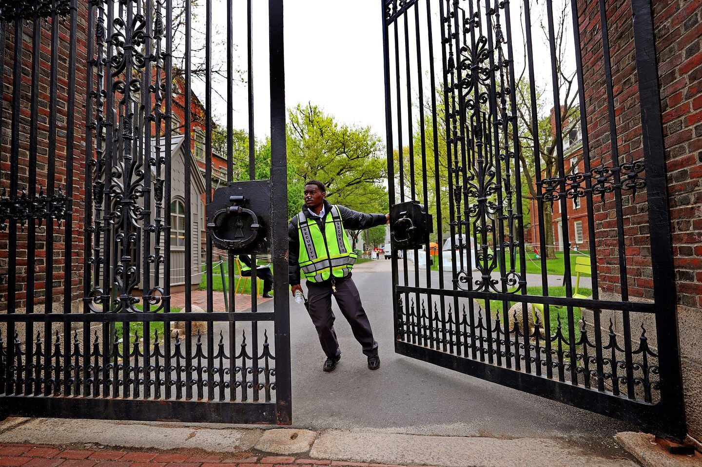 A security guard monitored a gate during the pro-Palestinian encampment at Harvard Yard in May.