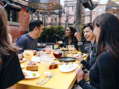 Group enjoying a meal together in Canada