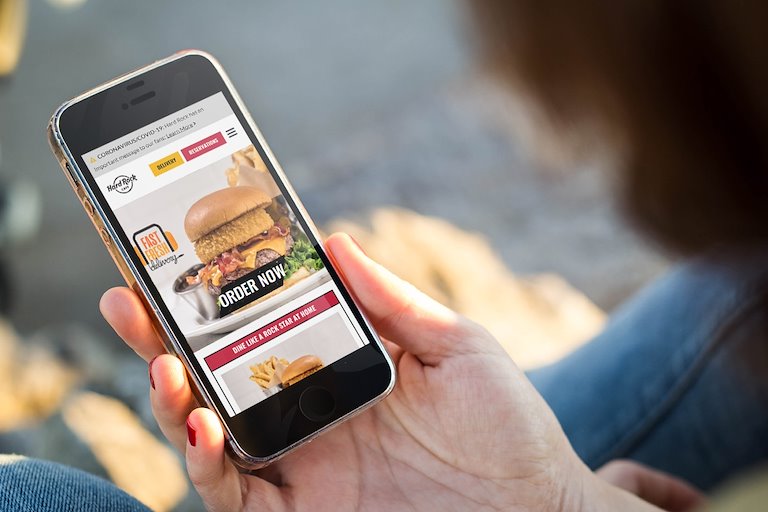 Guest ordering Hard Rock Cafe Delivery from mobile device