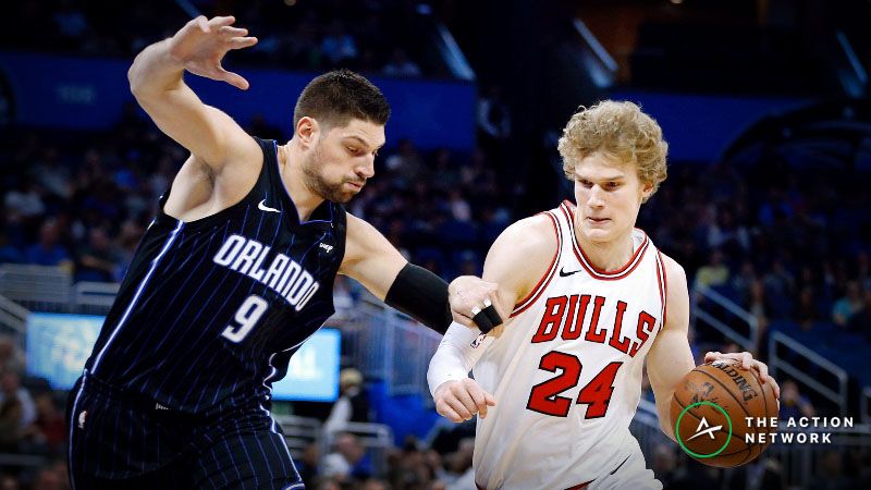 Chicago Bulls forward Lauri Markkanen (24) drives around Orlando Magic center Nikola Vucevic (9) during the first quarter at Amway Center.