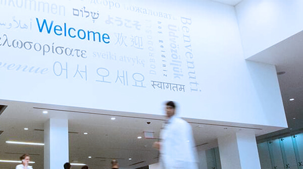 Photo of Hospital entrance with Welcome written in many languages