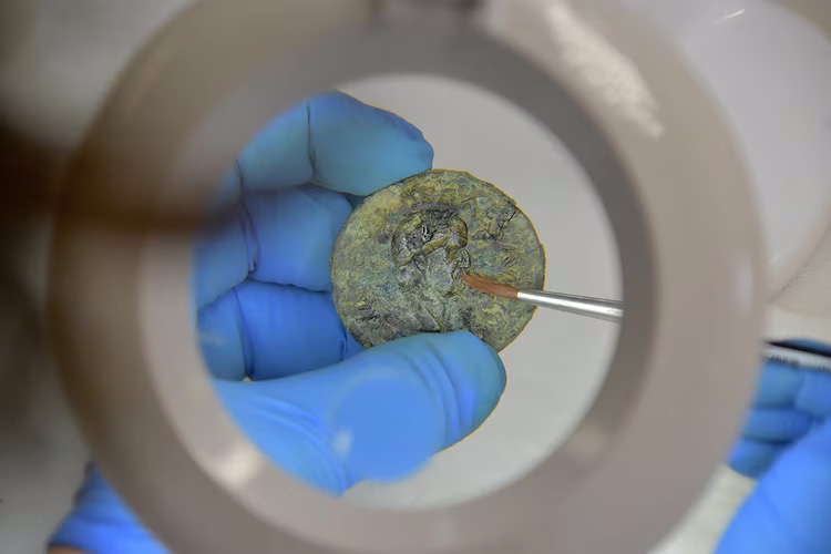 Archeologists discovered a small cache of treasure with gold, silver and bronze coins, and some jewelry during the recent excavations of Region IX, Insula 10 in Pompeii.