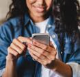 woman tapping on her phone