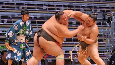 FUKUOKA, JAPAN - NOVEMBER 19: Unidentified Sumo wrestlers engaging in the arena of the Fukuoka Tournament on November 19, 2010 in Fukuoka, Japan.