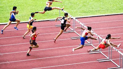 Men jumping hurdles (track sport; athletics; athlete)