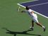 young man playing tennis