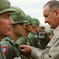 Vietnam War. U.S. President Lyndon B. Johnson awards the Distinguished Service Cross to First Lieutenant Marty A. Hammer, during a visit to military personnel, Cam Ranh Bay, South Vietnam, October 26, 1966. President Johnson