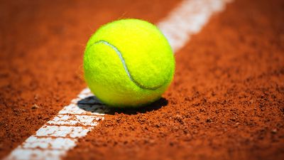 Green Tennis Ball on a tennis court