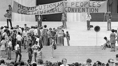 The Black Panther Party gathers on the steps of the Lincoln Memorial with a banner during the Revolutionary People's Constitutional Convention, June 19, 1970.