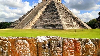 Chichen Itza. Chichen Itza and the Wall of Skulls (Tzompantli). Ruined ancient Mayan city of Chichen Itza located in southeastern Mexico. UNESCO World Heritage site.