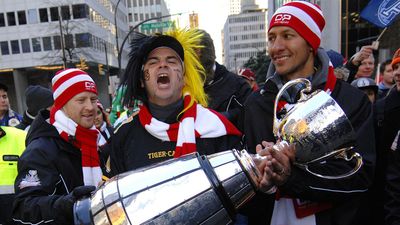 VANCOUVER, CANADA - NOVEMBER 11, 2011: Football fans arrive to BC Place to watch BC Lions playing in Grey Cup finals in Vancouver, Canada, on November 11, 2011.