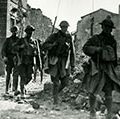 American infantry streaming through the captured town of Varennes, France, 1918.This place fell into the hands of the Americans on the first day of the Franco-American assault upon the Argonne-Champagne line. (World War I)