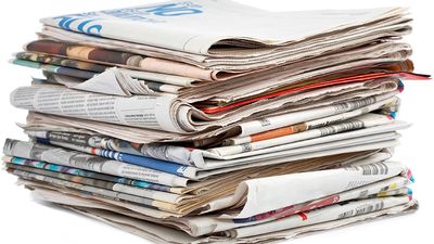 Stack of newspapers on white background. (Paper)