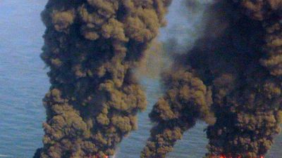 Clouds of smoke billow up from controlled burns taking place in the Gulf of Mexico May 19, 2010. The controlled burns were set to reduce the amount of oil in the water following the Deepwater Horizon oil spill. BP spill