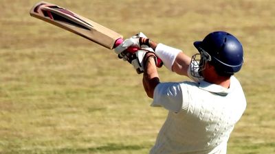 Cricket batsman playing a pull shot.