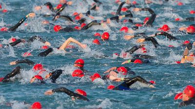 The start of the swimming phase of a ironman triathlon in Frankfurt, Germany. (extreme sports)