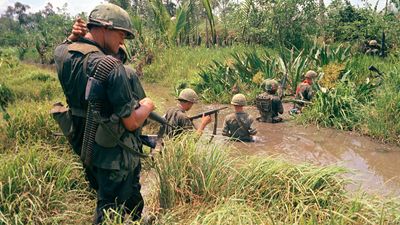 U.S. trooops of the 7th. and 9th. divisions wade through marshland during a joint operation on South Vietnam's Mekong Delta, April 1967.