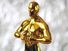 Hollywood Golden Oscar Academy award statue on blue background. Success and victory concept.