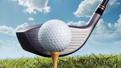 Golf putter hitting golf tee and ball. (game; sport; golf ball; golf club)