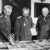 Meeting of leaders in W.W.I, General Hindenburg, Kaiser William II, General Ludendorff examine maps during World War I in Germany.