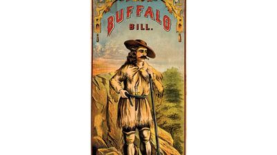 Buffalo Bill. William Frederick Cody. Portrait of Buffalo Bill (1846-1917) in buckskin clothing, with rifle and handgun. Folk hero of the American West. lithograph, color, c1870