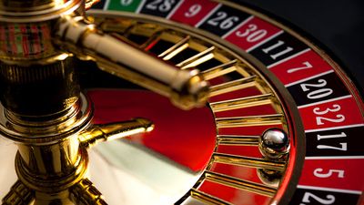 Close-up of a roulette wheel with the ball on black number 17. (gambling, games of chance, gaming)