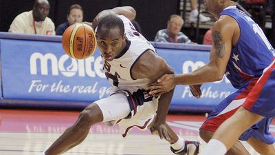 United States' Kobe Bryant, left, drives past Puerto Rico's Elias Ayuso during in the third quarter of their FIBA Americas Championship basketball game at the Thomas & Mack Center in Las Vegas, Saturday, Sept. 1, 2007