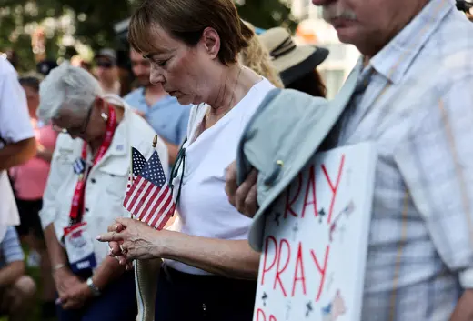 Supporters of former U.S. President Donald Trump attend a prayer vigil hosted by Turning Point Action near the venue for the Republican National Convention (RNC),.