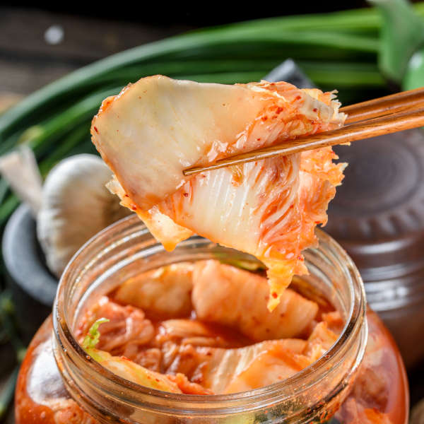 kimchi being eaten with chopsticks