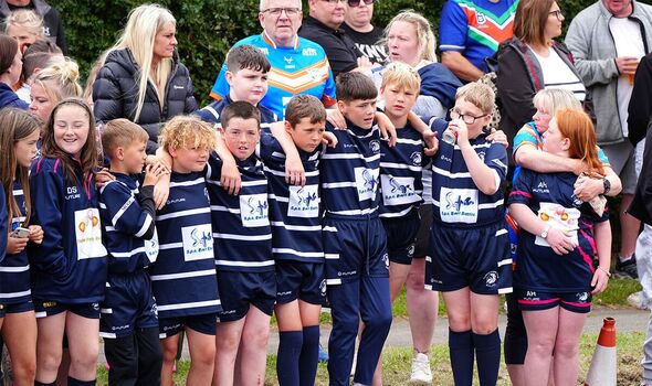 Members of the Featherstone Lions ARLFC line cortege