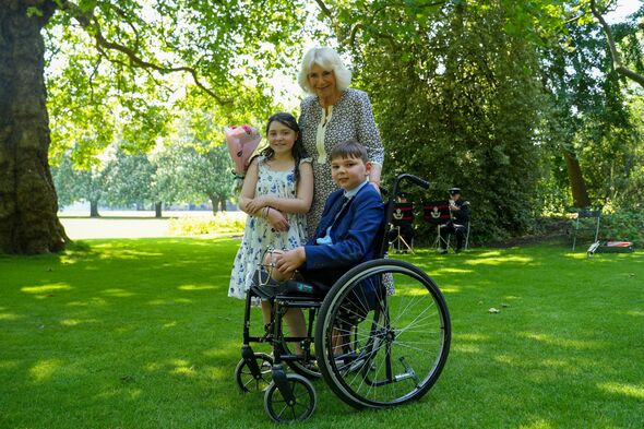 queen camilla with tony hudgell and lyla o'donovan