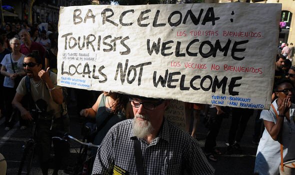 A sign at an overtourism protest.